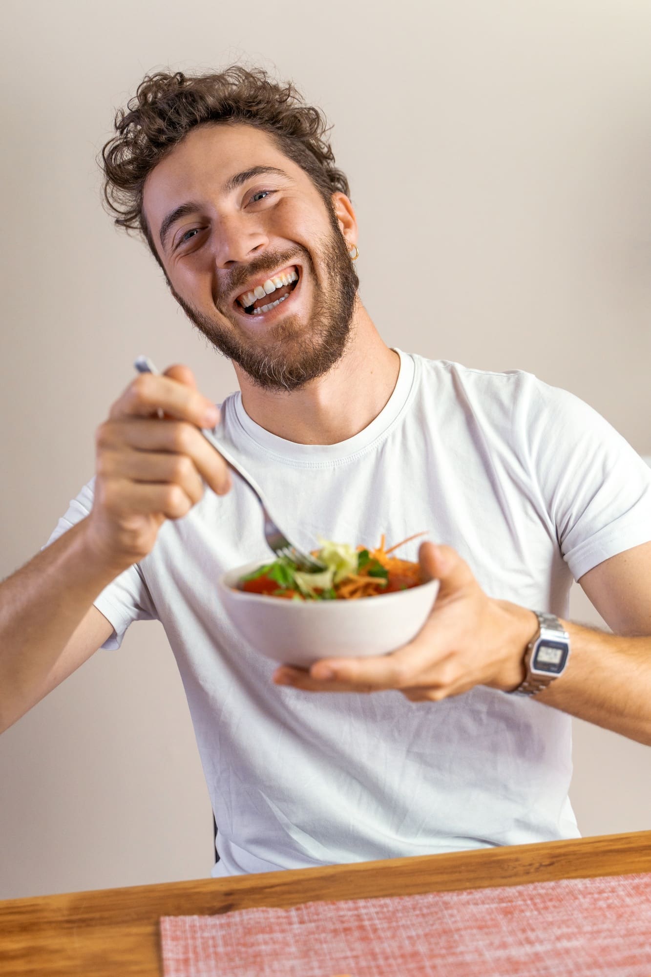 Smiling Man Eating Healthy Salad - Enjoying a Nutritional Meal