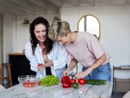 Happy girlfriends preparing healthy lunch Happy girlfriends preparing healthy lunch